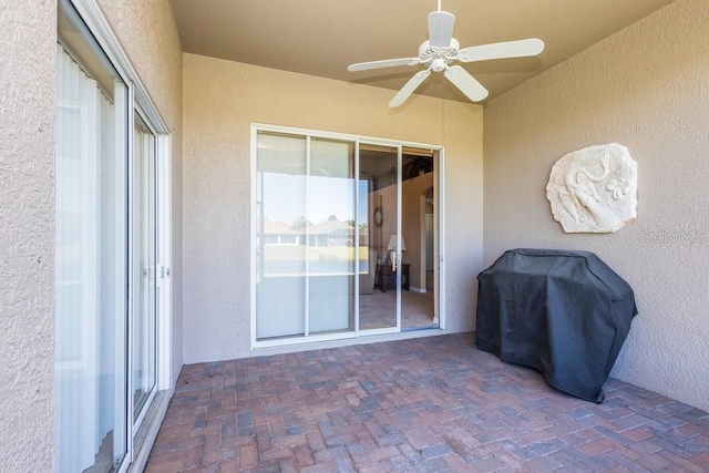 view of patio / terrace featuring area for grilling and a ceiling fan