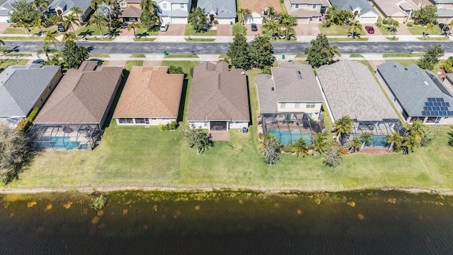 aerial view with a residential view and a water view