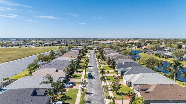 bird's eye view with a residential view and a water view