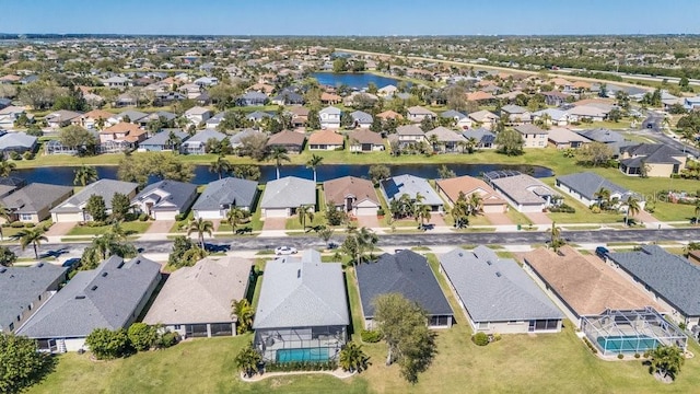 birds eye view of property featuring a residential view and a water view