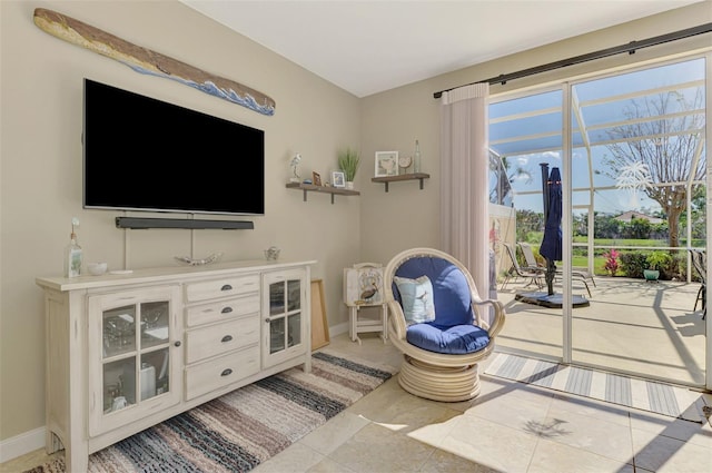 interior space featuring tile patterned floors and baseboards