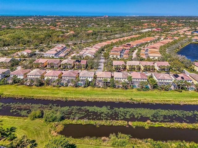 birds eye view of property with a residential view and a water view