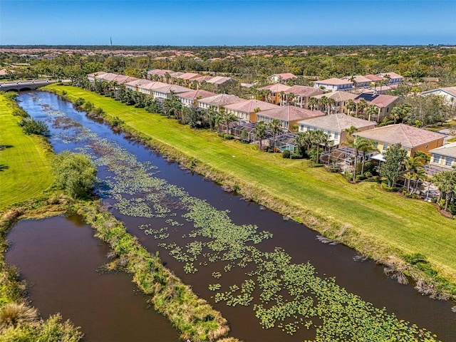 bird's eye view featuring a residential view and a water view