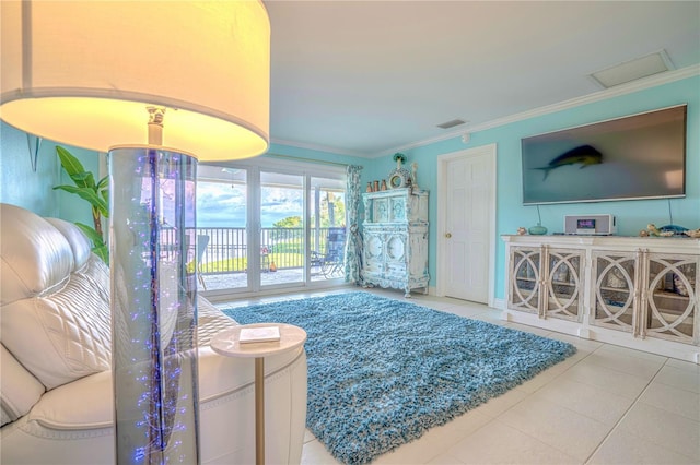 tiled living area with visible vents and ornamental molding