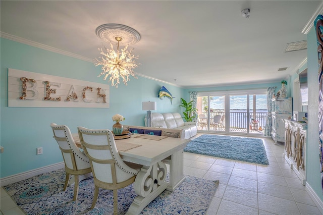 dining area featuring light tile patterned floors, a chandelier, baseboards, and ornamental molding