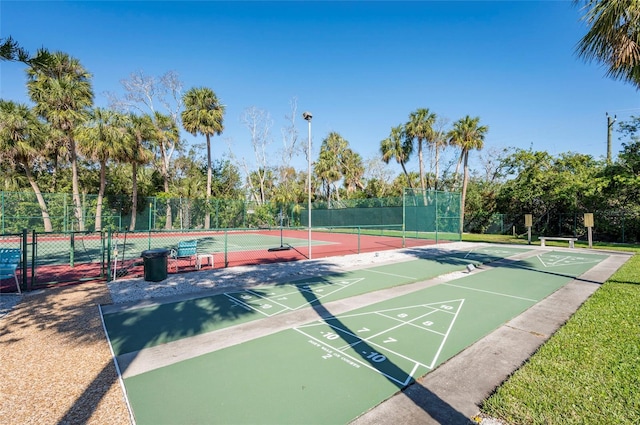 5013 Village Gardens Dr Unit 34, Sarasota, FL 34234 - surrounding community featuring a tennis court and shuffleboard
