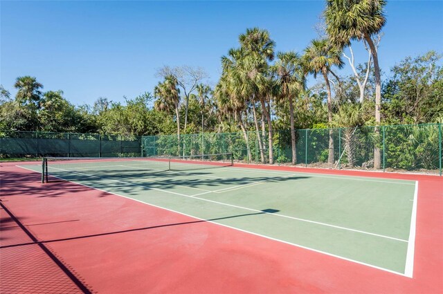 5013 Village Gardens Dr Unit 34, Sarasota, FL 34234 - view of tennis court with community basketball court