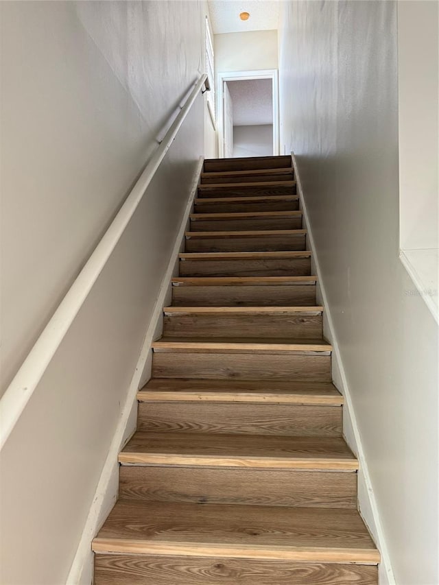 5681 Bentgrass Dr Unit 13-201, Sarasota, FL 34235 - stairs featuring wood finished floors
