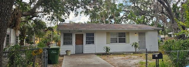 view of outbuilding with fence