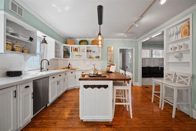 kitchen featuring visible vents, white cabinetry, open shelves, a sink, and stainless steel dishwasher