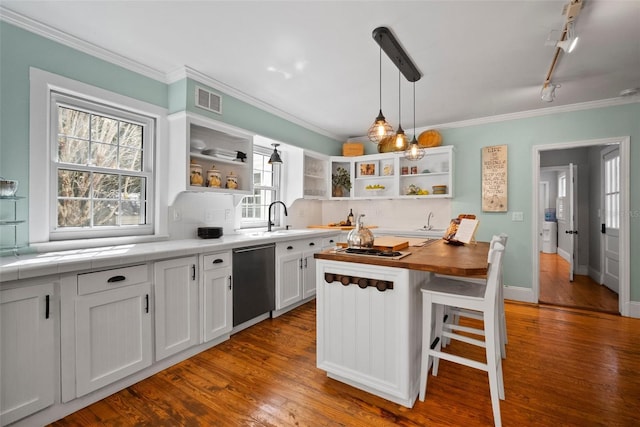 kitchen with dishwasher, open shelves, visible vents, and ornamental molding