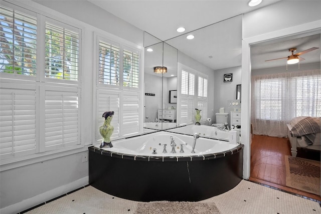 full bathroom with wood finished floors, recessed lighting, ceiling fan, ensuite bathroom, and a jetted tub