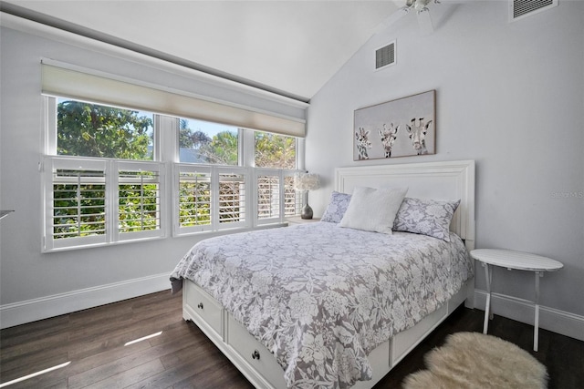 bedroom featuring visible vents, multiple windows, and dark wood-style floors