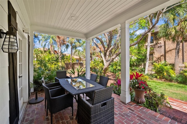 view of patio / terrace featuring outdoor dining area and fence