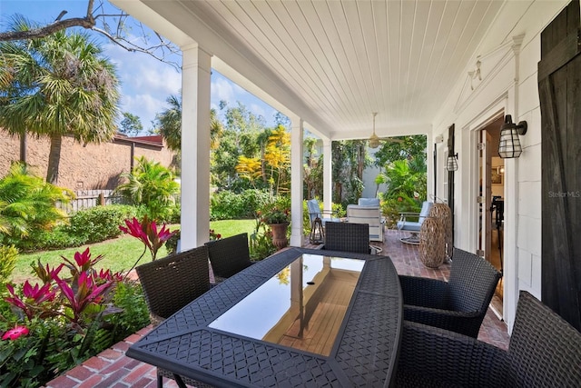 view of patio featuring outdoor dining area