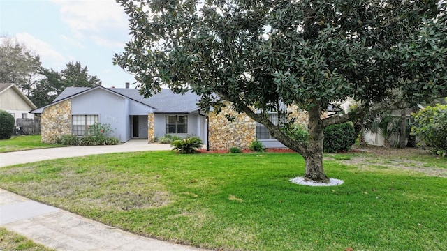 1776 E Cheryl Dr, Winter Park, FL 32792 - view of front of home featuring stone siding, concrete driveway, and roof with shingles
