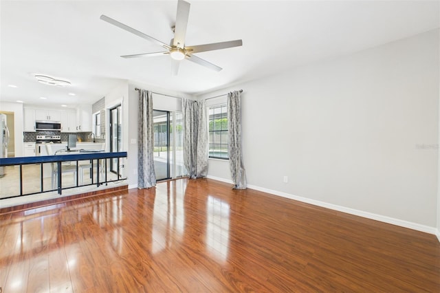 1776 E Cheryl Dr, Winter Park, FL 32792 - spare room featuring wood finished floors, baseboards, and a ceiling fan