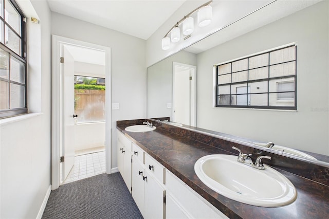 1776 E Cheryl Dr, Winter Park, FL 32792 - bathroom featuring double vanity and baseboards