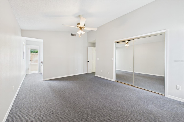 1776 E Cheryl Dr, Winter Park, FL 32792 - unfurnished bedroom with a closet, dark colored carpet, baseboards, ceiling fan, and lofted ceiling