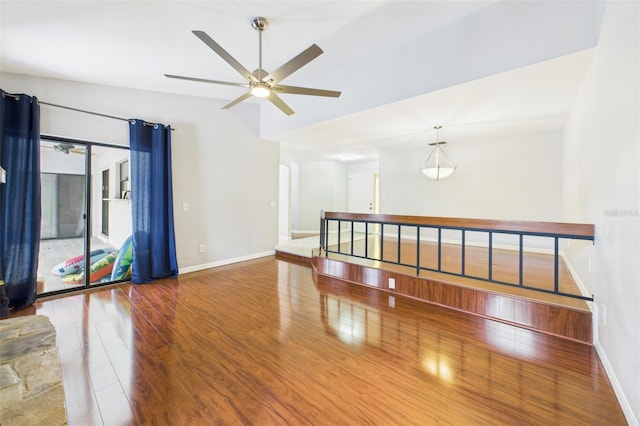1776 E Cheryl Dr, Winter Park, FL 32792 - empty room featuring wood finished floors, vaulted ceiling, a ceiling fan, and baseboards