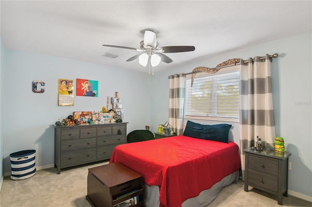 bedroom featuring visible vents, baseboards, light colored carpet, and ceiling fan