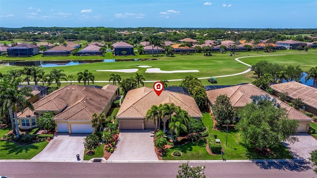 aerial view featuring golf course view, a water view, and a residential view