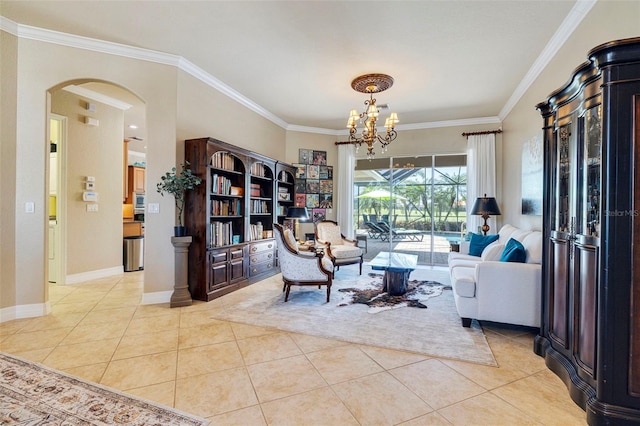 living room featuring ornamental molding, tile patterned flooring, arched walkways, and a chandelier