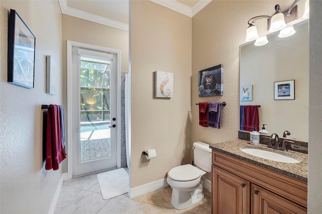 bathroom featuring crown molding, baseboards, toilet, vanity, and tile patterned flooring