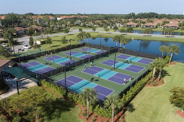 birds eye view of property with a water view and a residential view