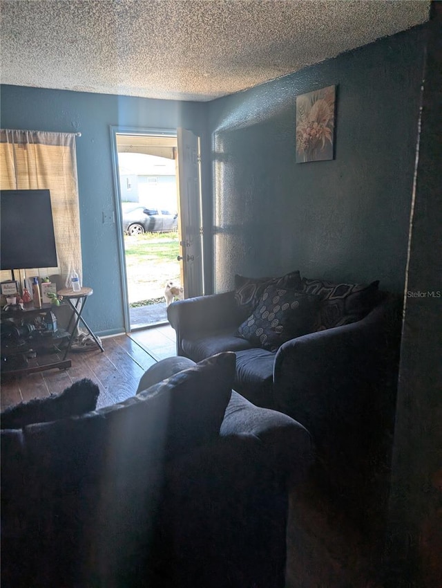 5195 Edwina St, Orlando, FL 32811 - living room featuring a textured ceiling and a textured wall
