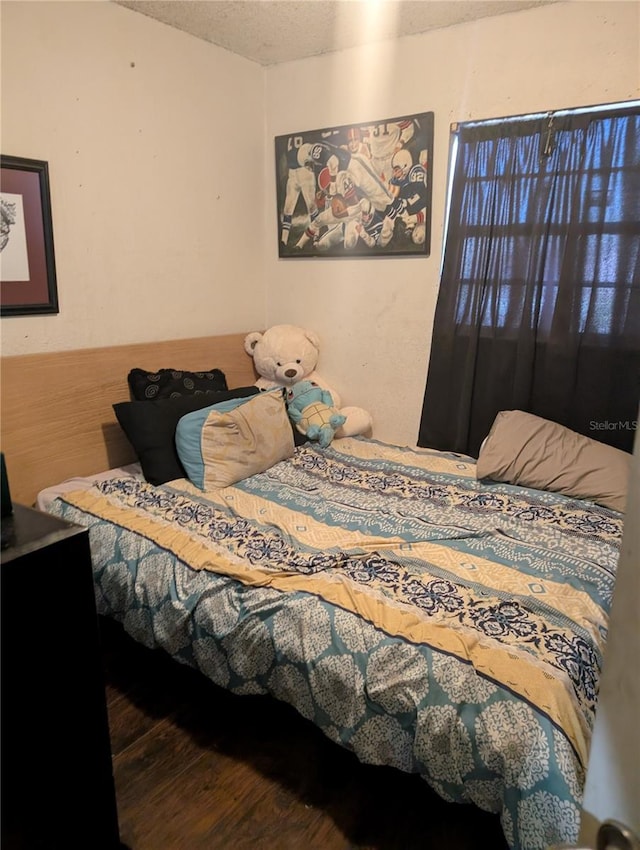 5195 Edwina St, Orlando, FL 32811 - bedroom featuring a textured ceiling and wood finished floors