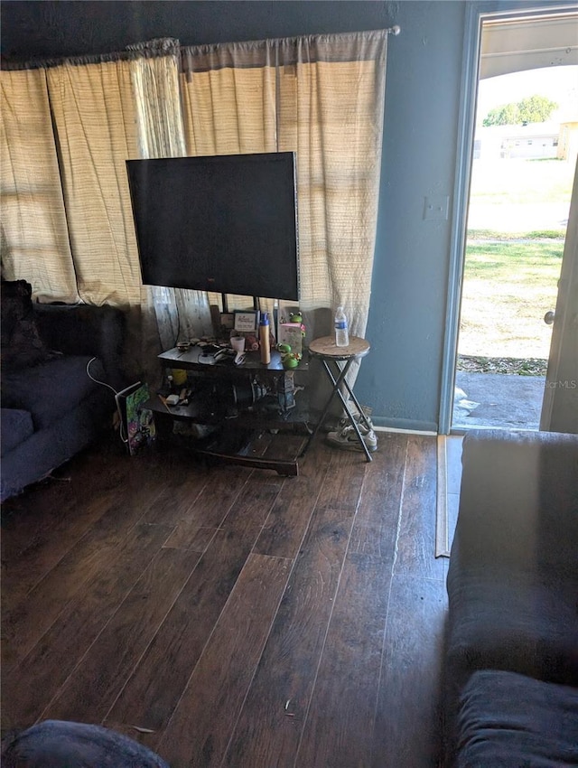 5195 Edwina St, Orlando, FL 32811 - living room featuring baseboards and hardwood / wood-style floors