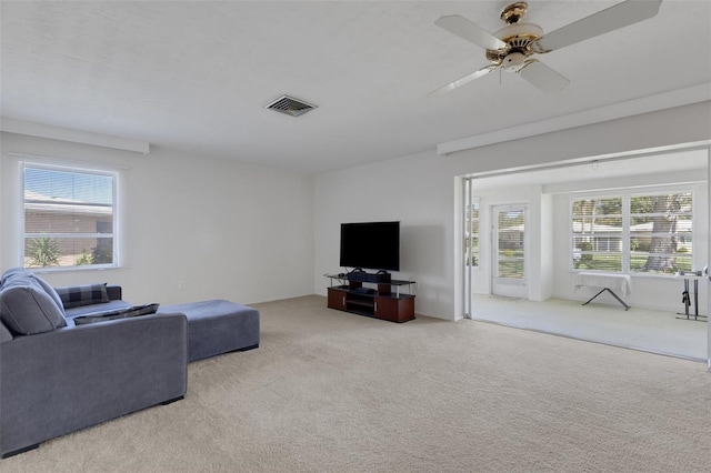 3140 Village Green Dr Unit 1119, Sarasota, FL 34239 - living room with carpet flooring, visible vents, and a ceiling fan