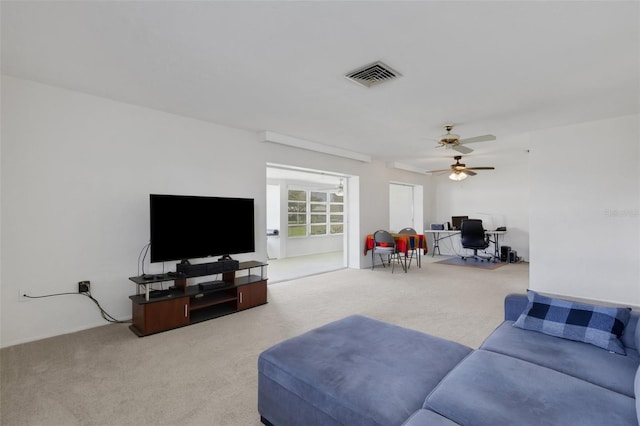 3140 Village Green Dr Unit 1119, Sarasota, FL 34239 - living room featuring visible vents, ceiling fan, and carpet floors