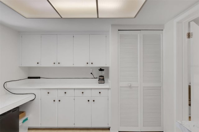 3140 Village Green Dr Unit 1119, Sarasota, FL 34239 - interior space featuring white cabinets and light countertops