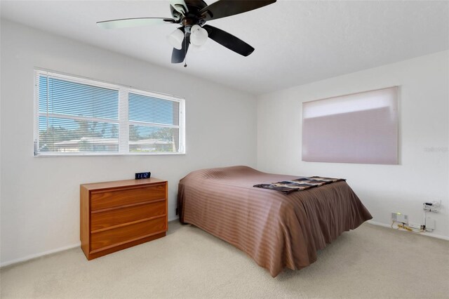 3140 Village Green Dr Unit 1119, Sarasota, FL 34239 - carpeted bedroom featuring baseboards and a ceiling fan