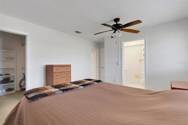 3140 Village Green Dr Unit 1119, Sarasota, FL 34239 - bedroom featuring visible vents, ceiling fan, carpet flooring, and ensuite bathroom