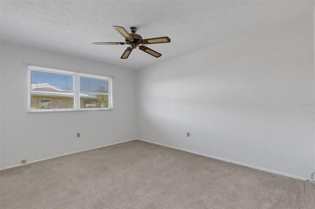 3140 Village Green Dr Unit 1119, Sarasota, FL 34239 - unfurnished room featuring ceiling fan, baseboards, and carpet floors