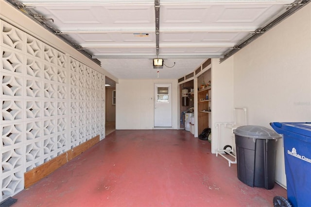 3140 Village Green Dr Unit 1119, Sarasota, FL 34239 - garage with visible vents and a garage door opener