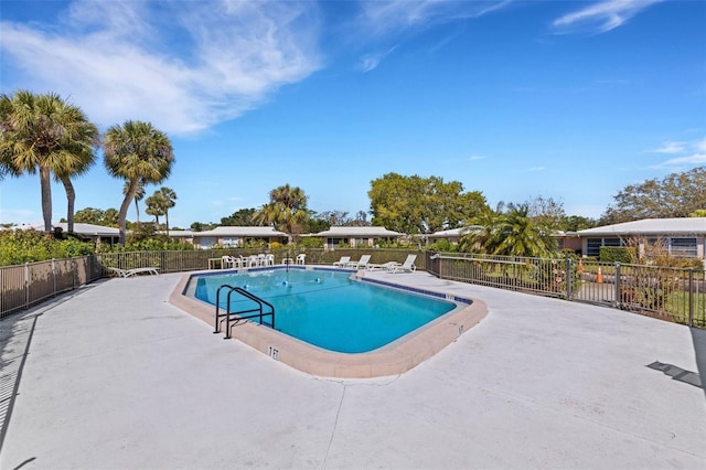 3140 Village Green Dr Unit 1119, Sarasota, FL 34239 - community pool featuring fence and a patio