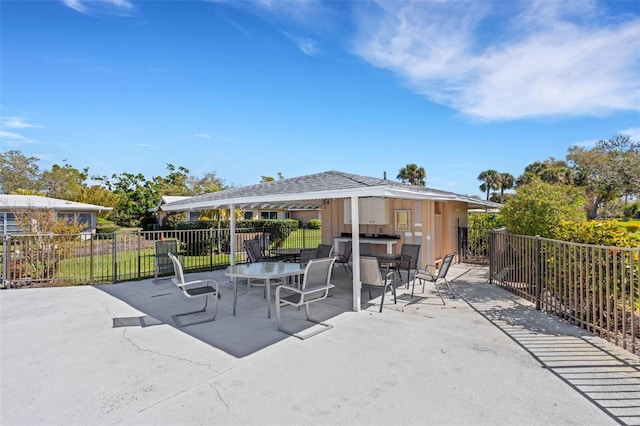 3140 Village Green Dr Unit 1119, Sarasota, FL 34239 - view of patio / terrace with fence and outdoor dry bar