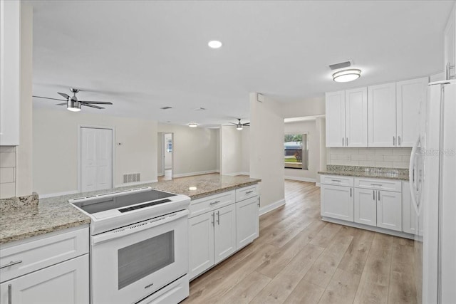 kitchen featuring light wood-style flooring, white appliances, tasteful backsplash, and ceiling fan