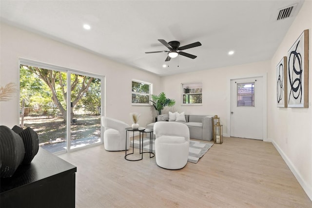 6639 16th St N, Saint Petersburg, FL 33702 - living area with light wood-style flooring, baseboards, visible vents, and ceiling fan