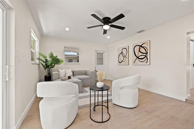 6639 16th St N, Saint Petersburg, FL 33702 - living room featuring visible vents, light wood-style flooring, baseboards, and ceiling fan