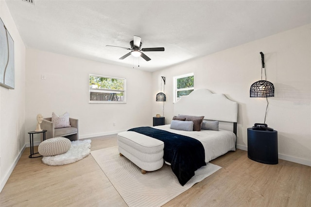 6639 16th St N, Saint Petersburg, FL 33702 - bedroom with a ceiling fan, baseboards, and wood finished floors