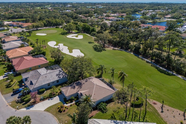 9408 Glen Abbey Ln, Sarasota, FL 34238 - aerial perspective of suburban area featuring a golf course, a nearby body of water, and a tree filled landscape