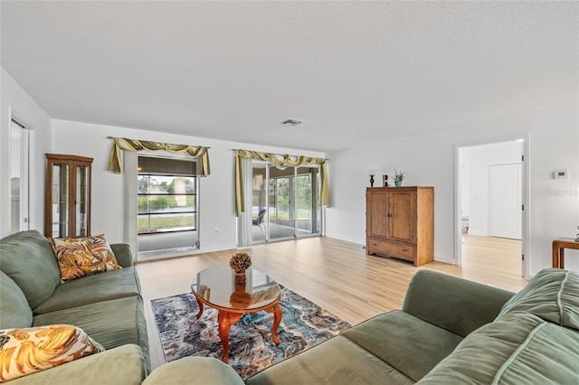 3611 22nd Ave W, Bradenton, FL 34205 - living area featuring wood finished floors and a textured ceiling