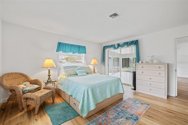 3611 22nd Ave W, Bradenton, FL 34205 - bedroom featuring access to exterior and wood finished floors