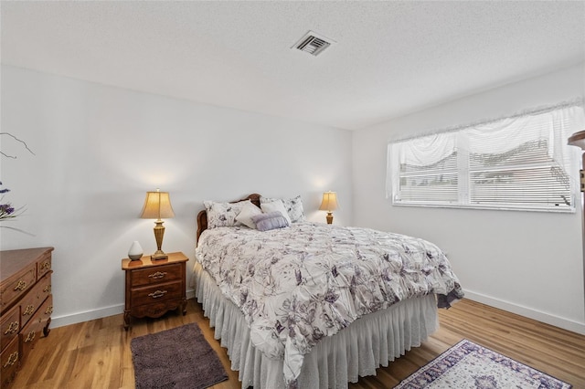 3611 22nd Ave W, Bradenton, FL 34205 - bedroom featuring light wood-style floors and baseboards