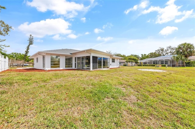 3611 22nd Ave W, Bradenton, FL 34205 - rear view of house featuring a yard and a sunroom